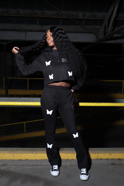 Dinamikplug Butterfly Takeover Sweat Set in black cotton with puff-print butterfly motifs worn by a model