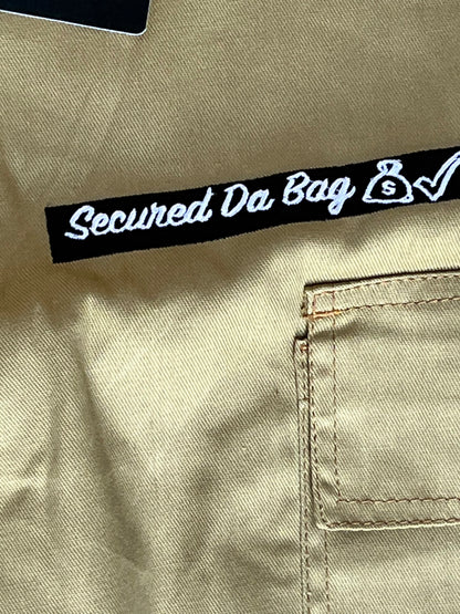 Dinamik Trap Star Cargo Shorts in tan with back pocket and Secured Da Bag tag, true-to-size daily wear.